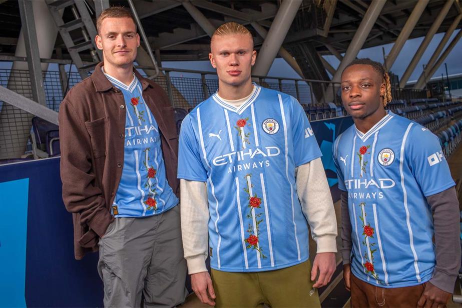Manchester City players (from left) Sergio Gómez, Erling Haaland and Jérémy Doku wear redesigned shirts