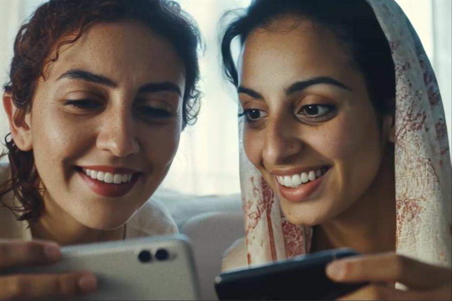 Two women looking at their phones