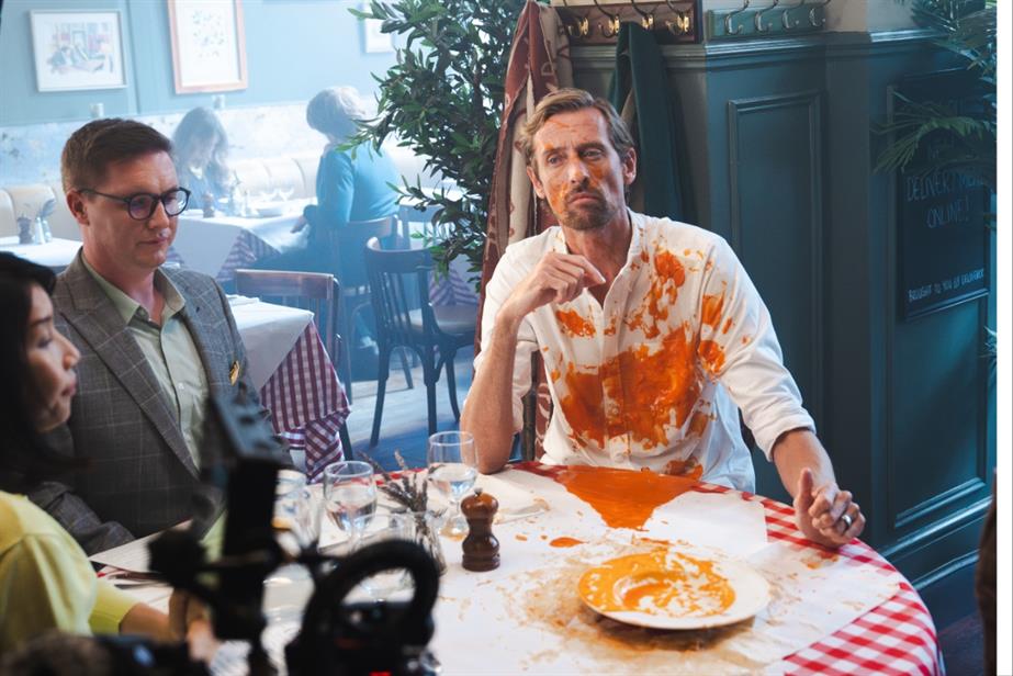 Peter Crouch with tomato soup spilled on his white shirt