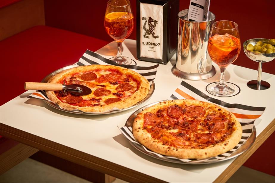 Two pizzas on a table 