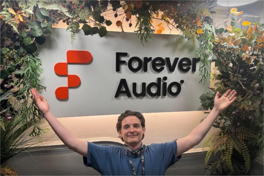 Image of Pierce Tully in front of Forever Audio sign