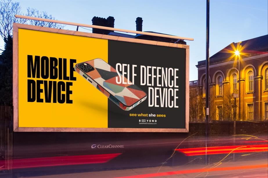 Billboard with copy saying mobile phone and self defence device