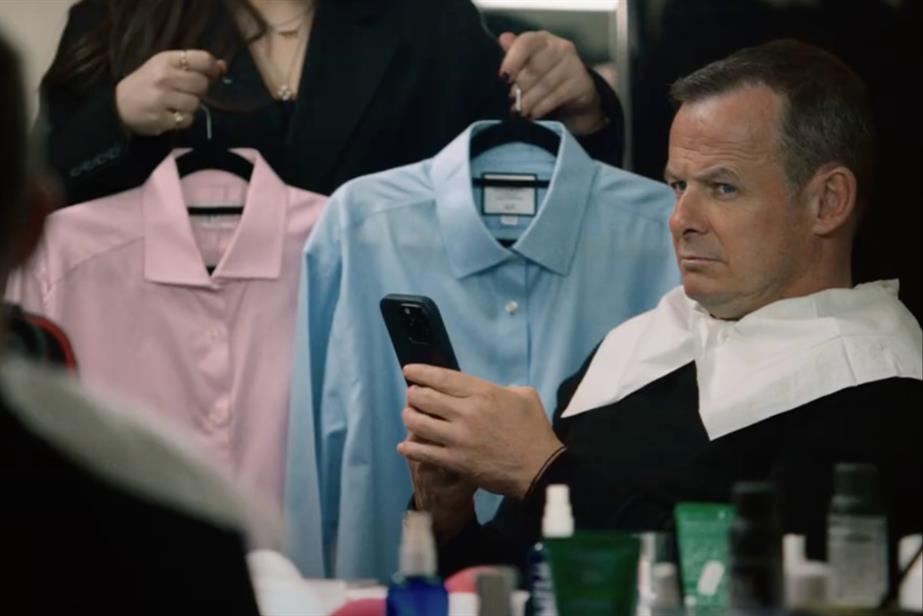 Austin Healey looking at shirts