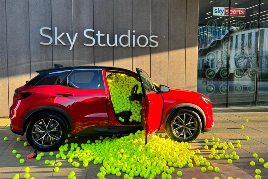 Lexus car with tennis balls flowing out of it outside Sky Studios