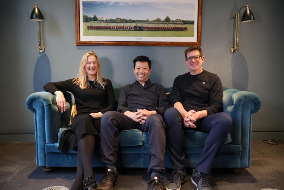 From left to right: Ellie Gauci, Michael Lee and Matt Broekhuizen sat on a blue sofa