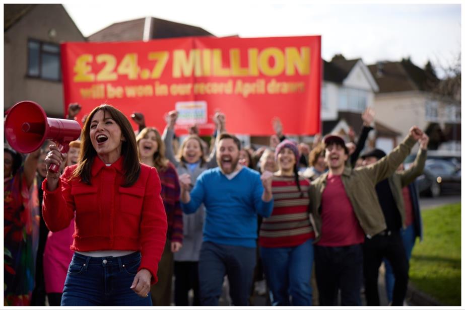 Davina McCall in front of crowd People's Postcode Lottery ad 2024