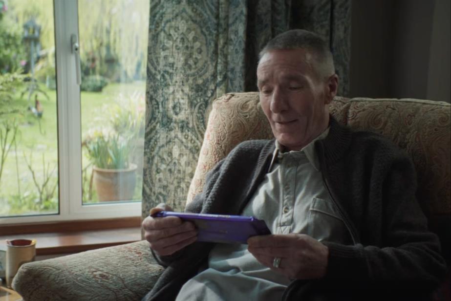 Man holding Cadbury Wholenut bar