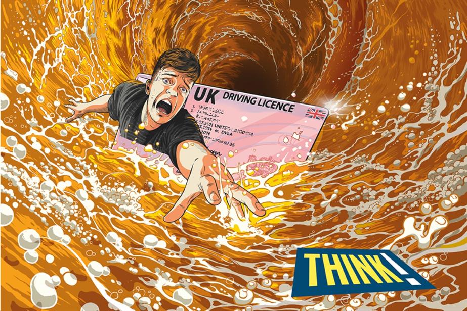 man and driving license in a pint of beer