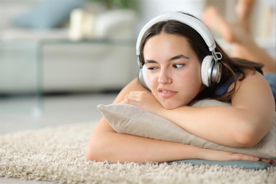 Image of woman wearing headphones