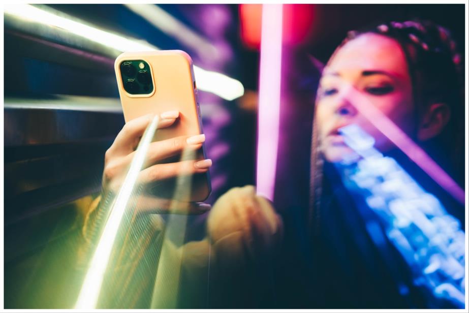 A woman holding a mobile phone