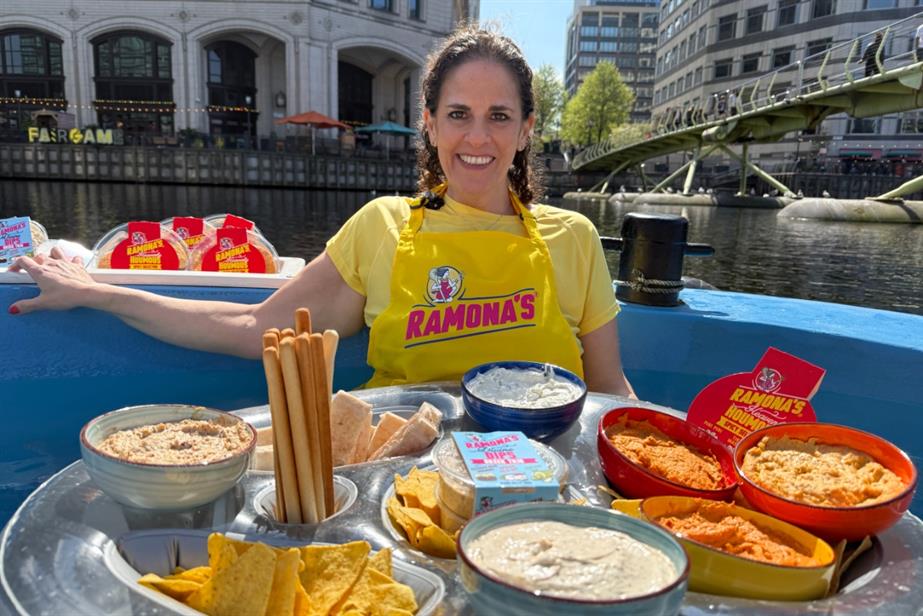 `Ramona Hazan of Ramona's Kitchen in a boat on the Thames surrounding by dips range