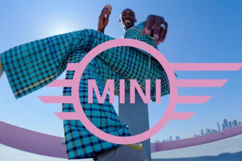 Mini logo with model behind