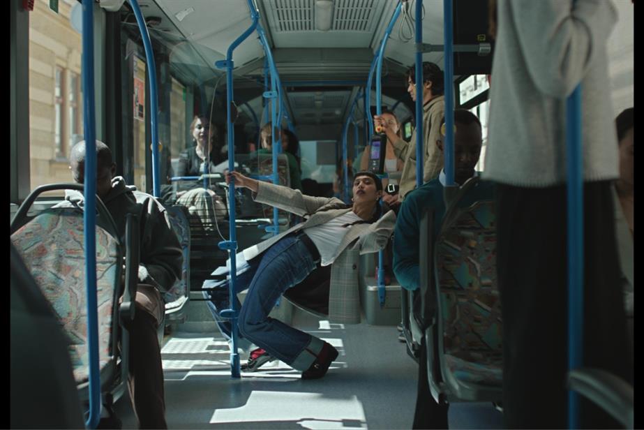 A woman dancing on a bus