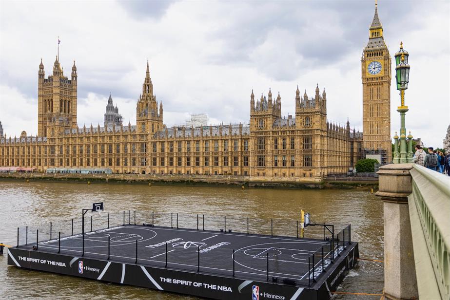 A floating basketball on the Thames, with the Houses of Parliament in the background