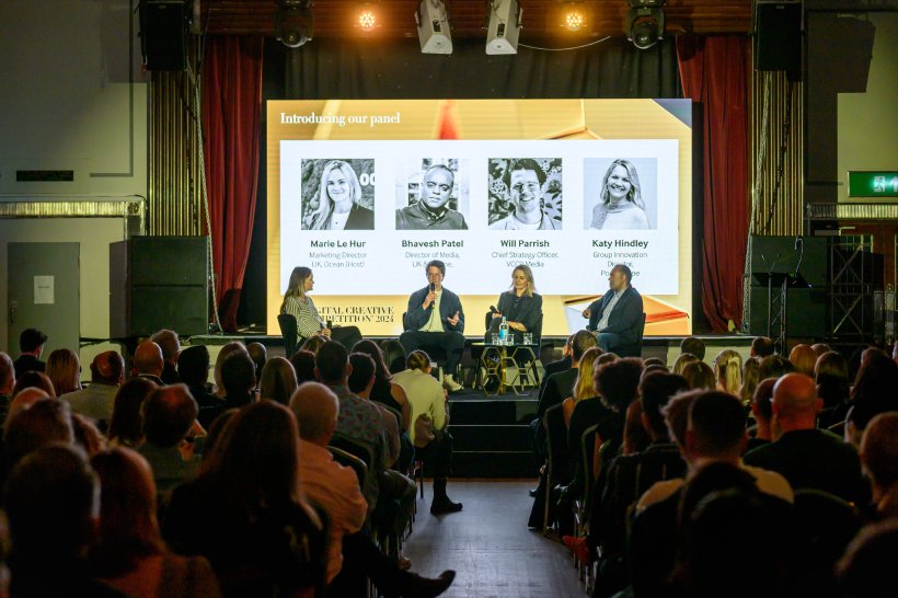 people on stage having discussion