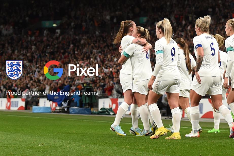 A photo of the Lionesses celebrating their Euros 2022 triumph, with Google Pixel branding and the words 'Proud partner of the England Teams'