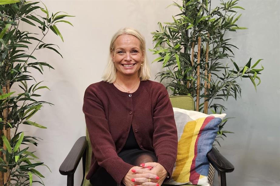 A picture of Rikke Wichmann-Bruun sitting in a chair