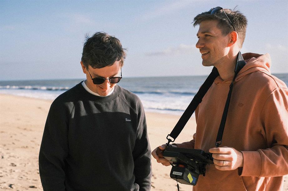 Witness founders Simon Frost and Ben Hanson on a beach