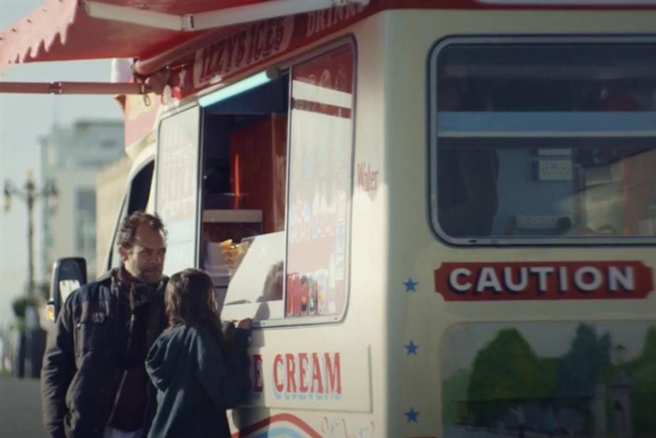 An ad for St James's Place: a father and daughter stand ordering from an ice cream van