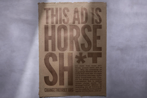 An ad made of horse manure, reading: 'This ad is horse sh*t'
