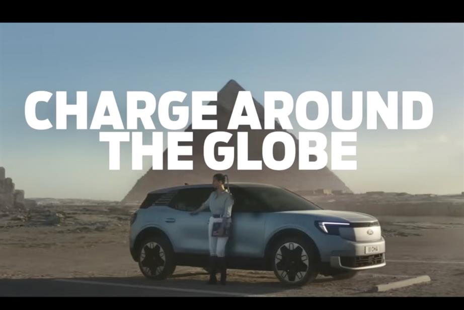 Ford ad: Lexie Alford stands in front of a Ford Explorer, with a pyramid in the background