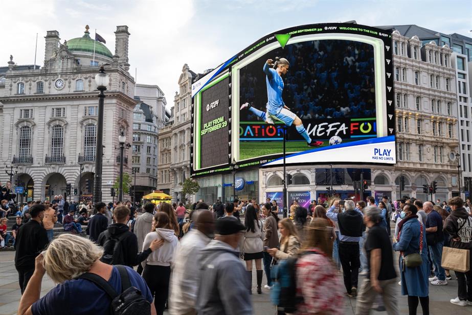 EA Sports FC 24 on PlayStation ad at Piccadilly Lights in London