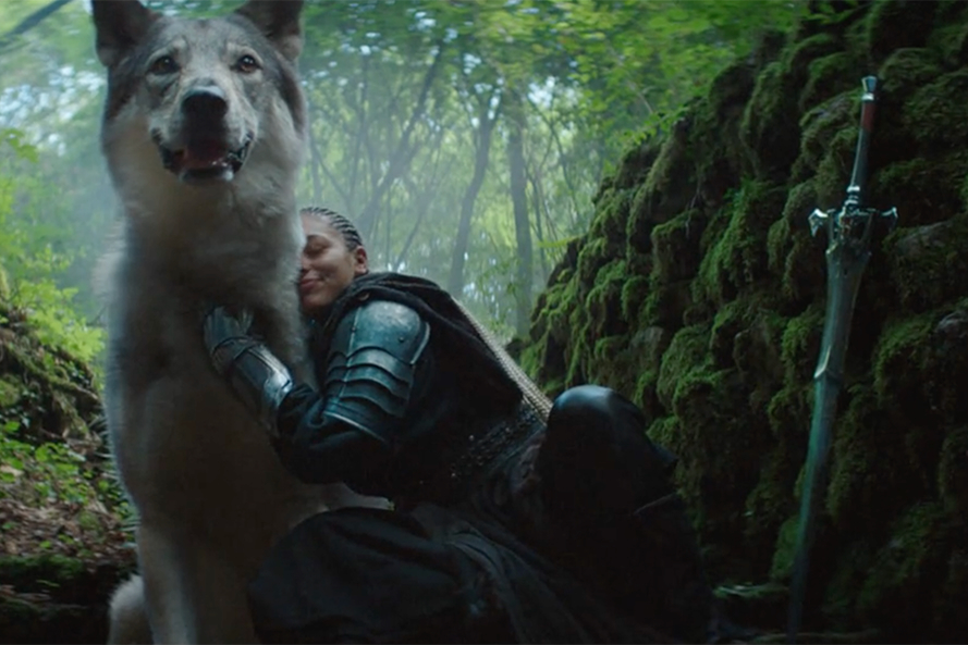 A woman and a wolf in Sony's PlayStation 5 ad