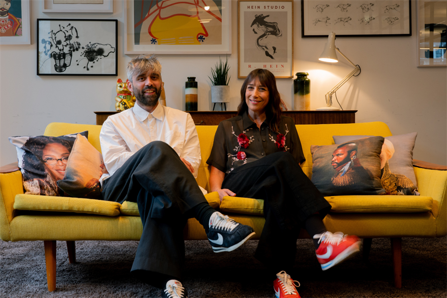 Damien Le Castrec and Shelley Smoler seating on a yellow sofa