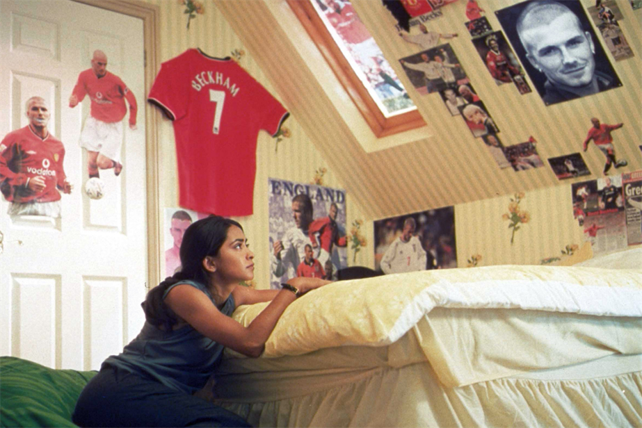 Parminder Nagra who plays Jess sitting in her bedroom in Bend It Like Beckham