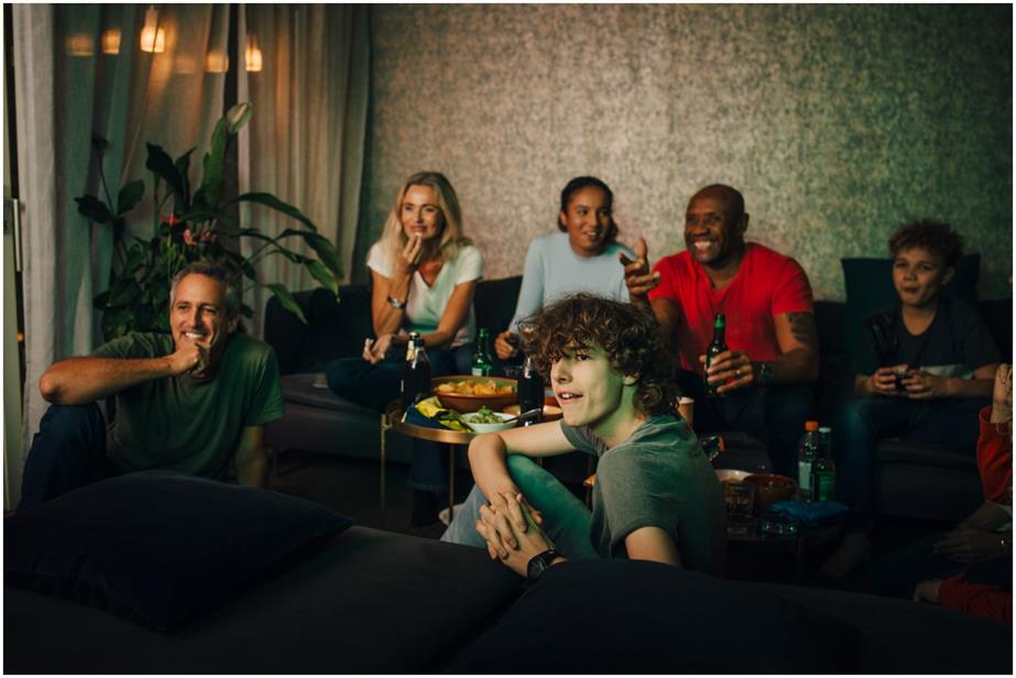 A group of people watching a screen