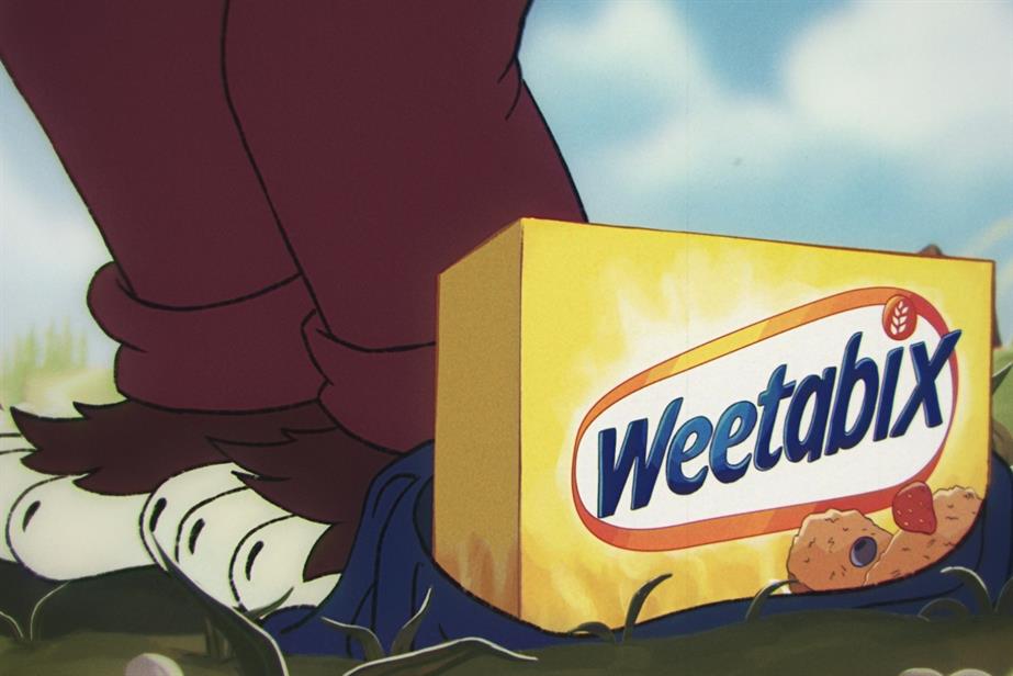 A box of Weetabix at the feet of an animal