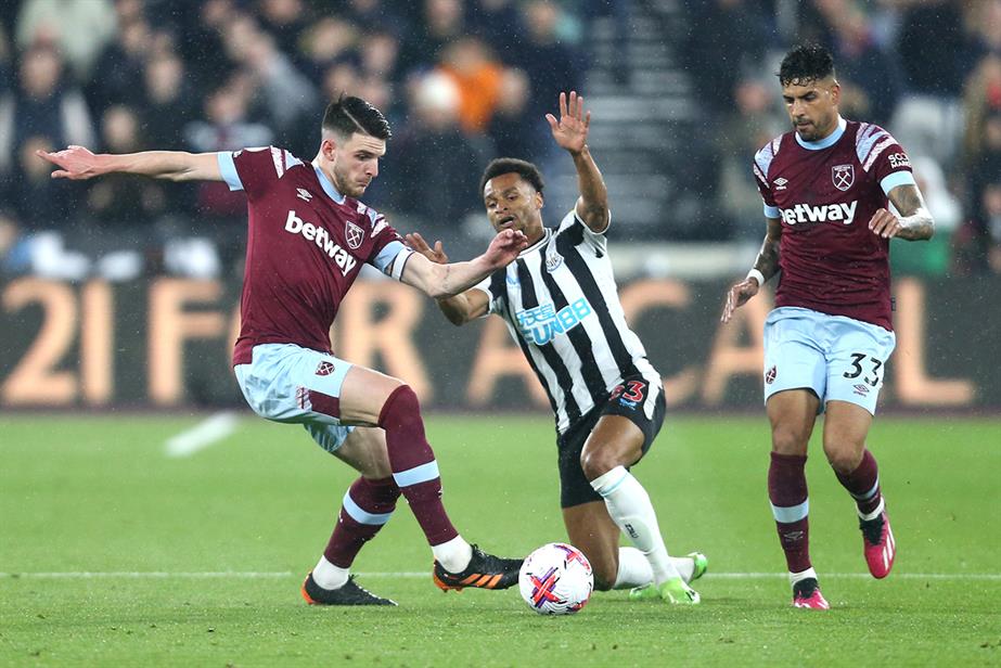 Two West Ham players tackle a Newcastle player in a recent Premier League match. Both clubs are sponsored by betting firms. Getty Images
