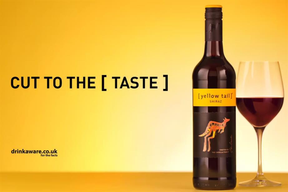 Yellow Tail: a bottle and a glass of red wine against a golden yellow background