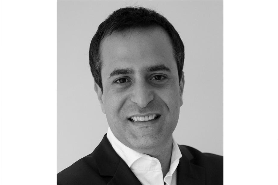 Black and white head and shoulders shot of Yilmaz Erceyes