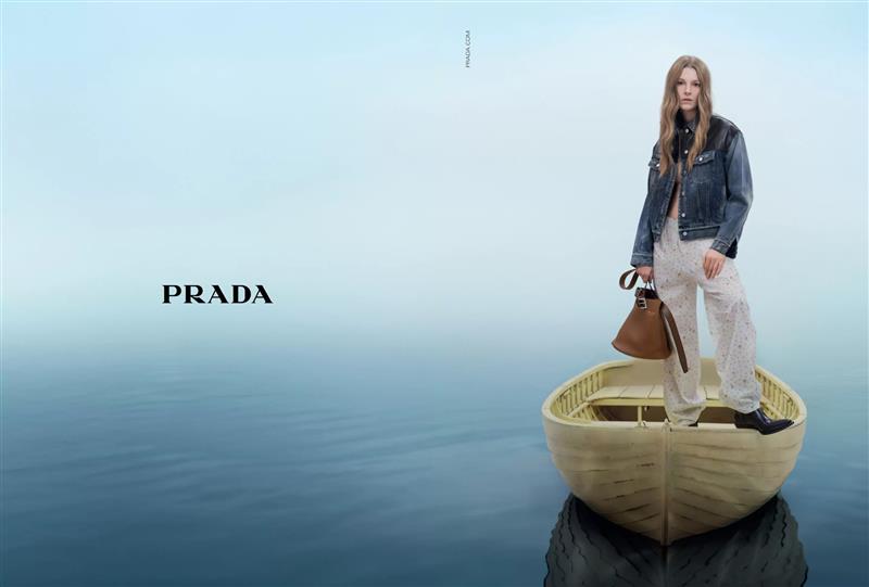 Prada advert - women standing in small boat on water
