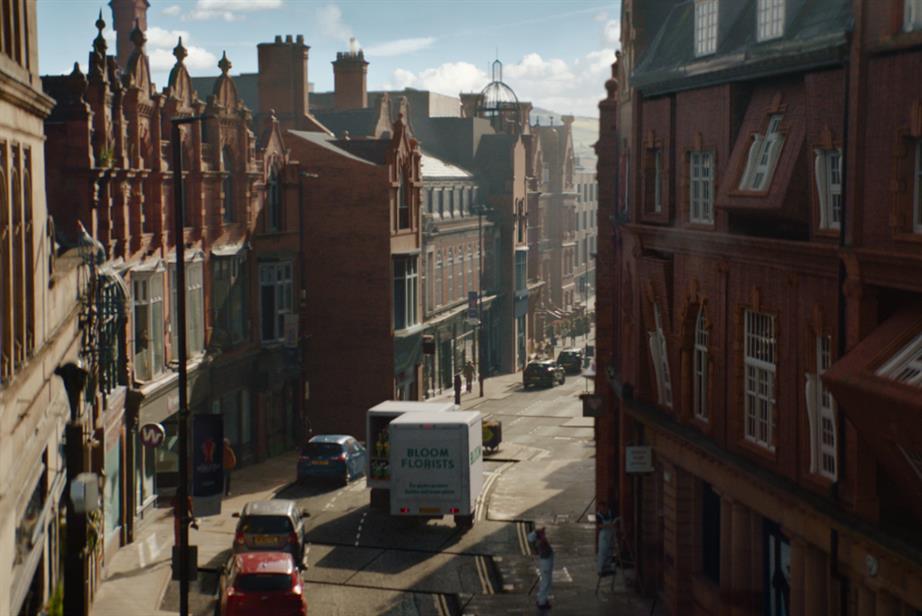 Street where the buildings are moving like puzzles