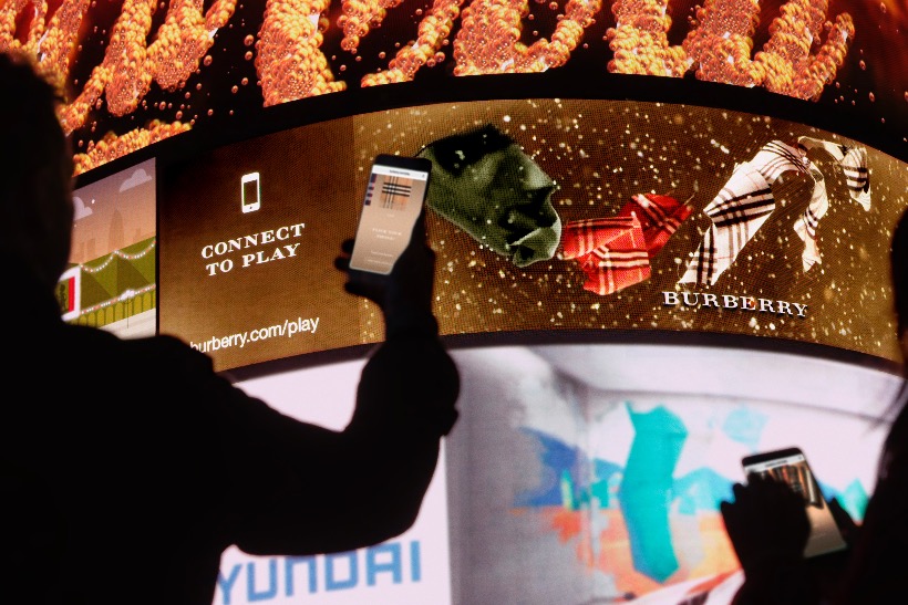Burberry: consumers can personalise scarves before the results appear on Piccadilly Circus' Curve screen
