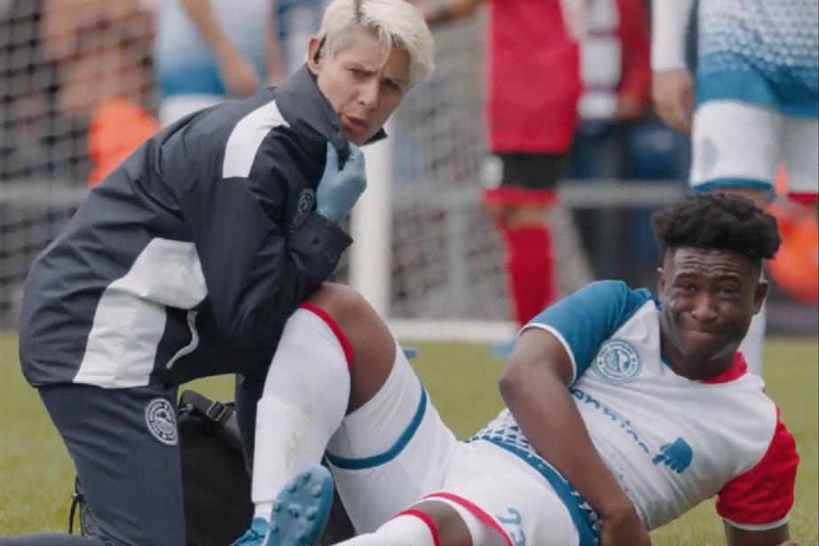 Injured football player with physio
