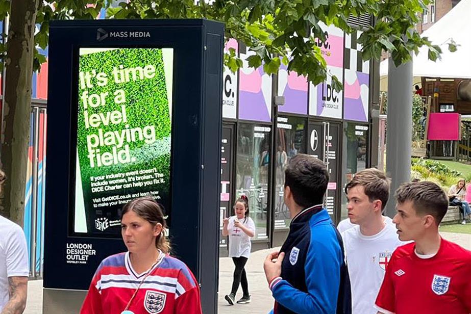 England Fans looking at an ad by DICE calling for a level playing field 