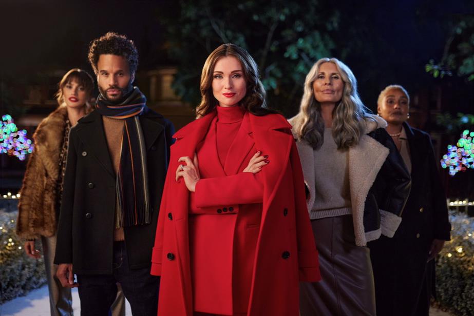 Sophie Ellis-Bextor in a red coat, surrounded by the Freemans Style Squad