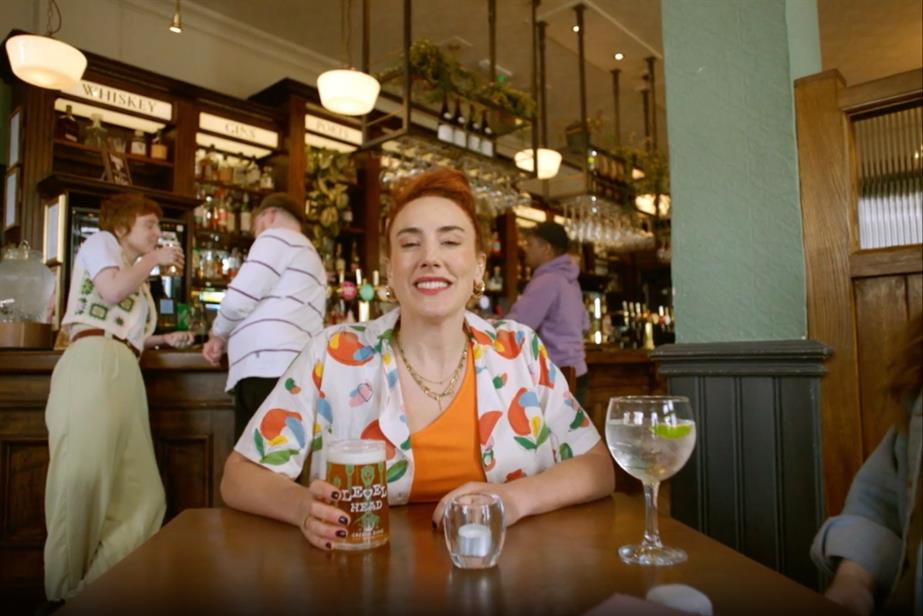 Woman smiling in a pub