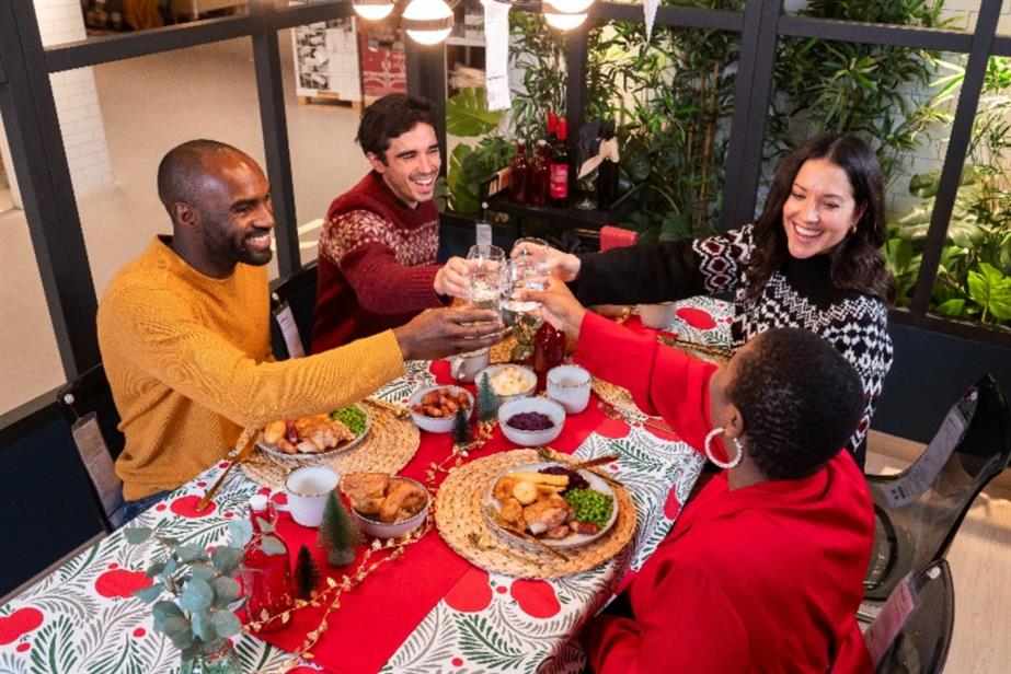 Friends having Christmas dinner in an Ikea roomset