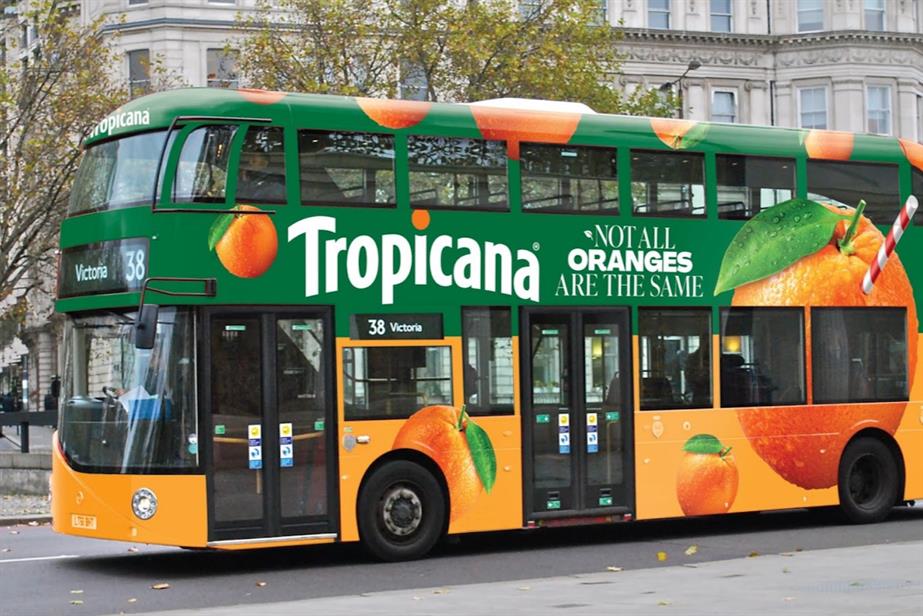 A bus covered in an ad for juice brand Tropicana and the words 'Not all oranges are the same'