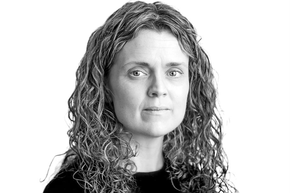 Black and white photo of woman with curly hair