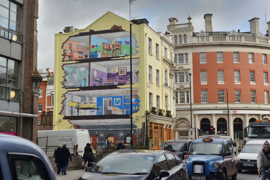 The mural appears to reveal a brightly-coloured family home