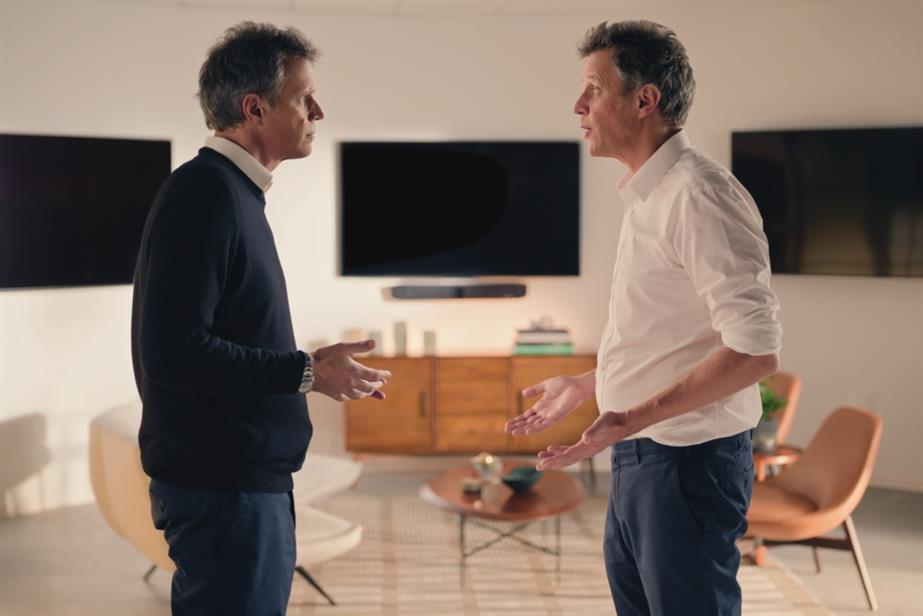 Arthur Sadoun standing opposite his AI twin