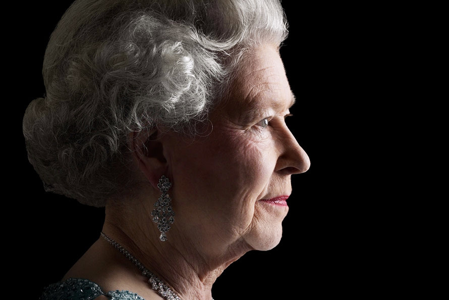 Queen Elizabeth II in profile in front of black background