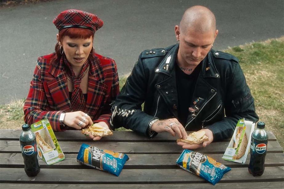 Two people eating a meal deal