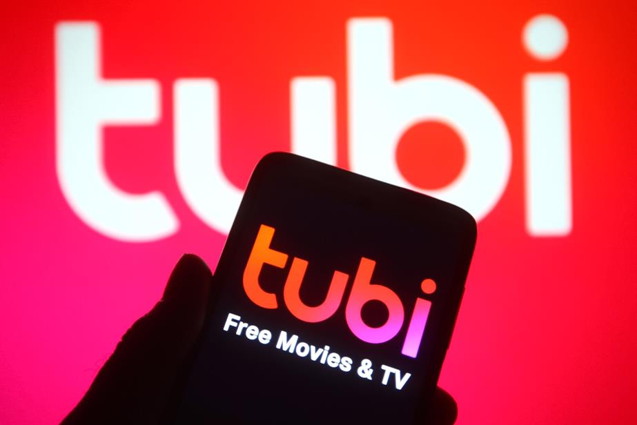 Tubi logo on phone and onscreen.