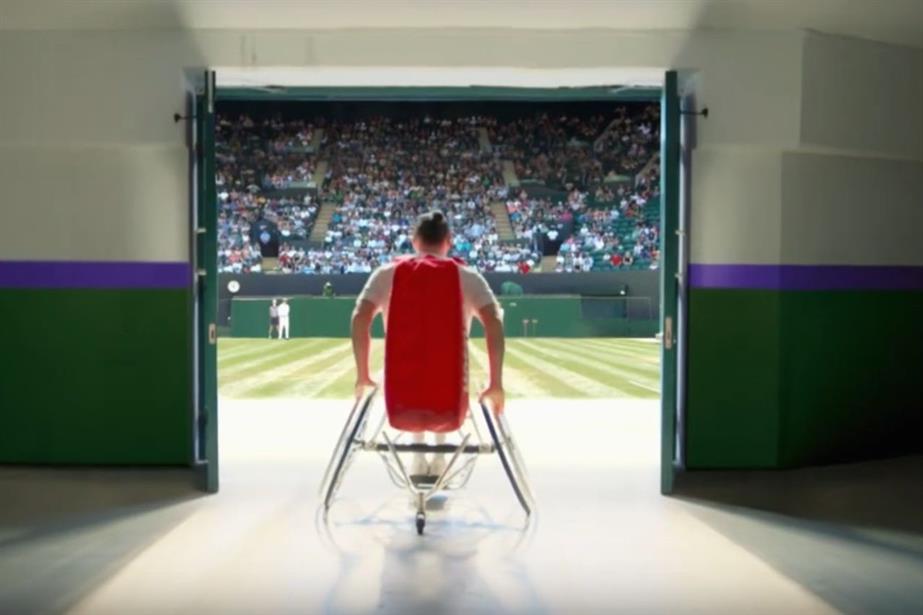 A tennis player in a wheelchair on his way to play at Wimbledon